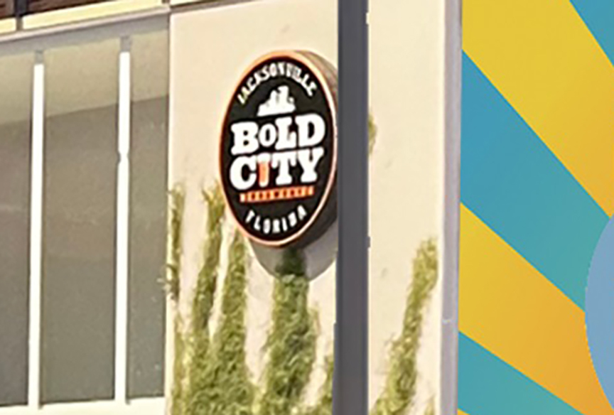 A sign for Bold City is shown on the building.