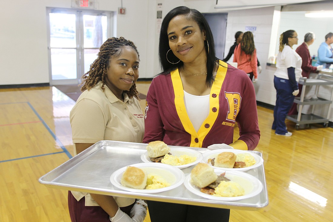 Shannon Clarke and Candice Heller help serve breakfast at the 2020 Dr. Martin Luther King Jr. Breakfast Celebration event. File photo by Jarleene Almenas