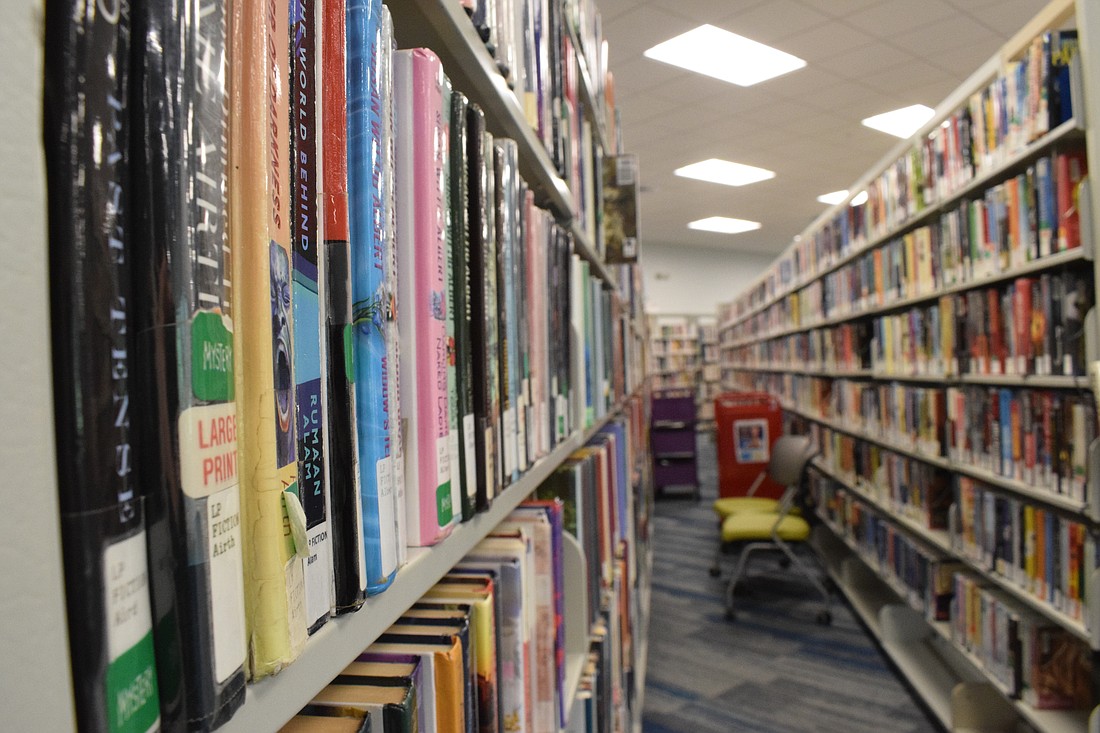 Each of the thousands of books at Braden River Library has to be tagged with a radio-frequency identification tag as part of the upgrades to get a self-checkout machine at the library.