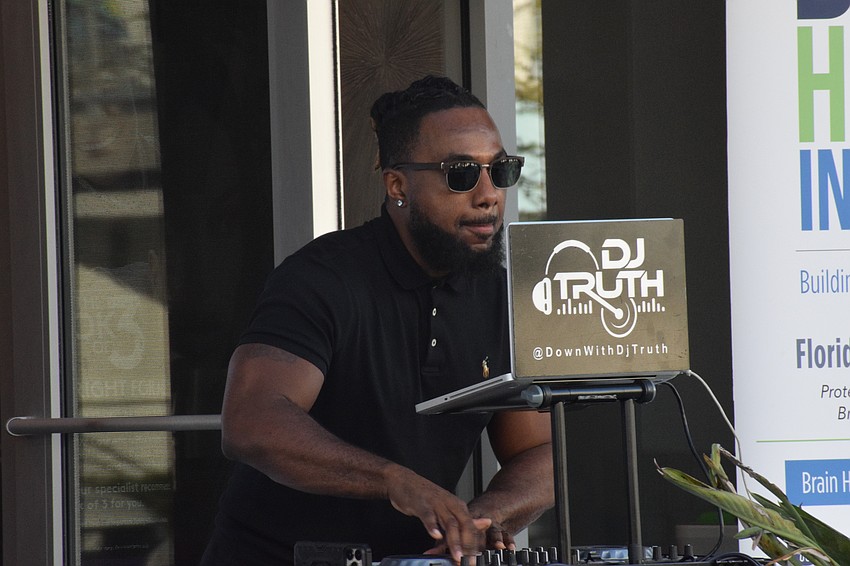 DJ Truth provides music to keep the beat up during the yoga class.