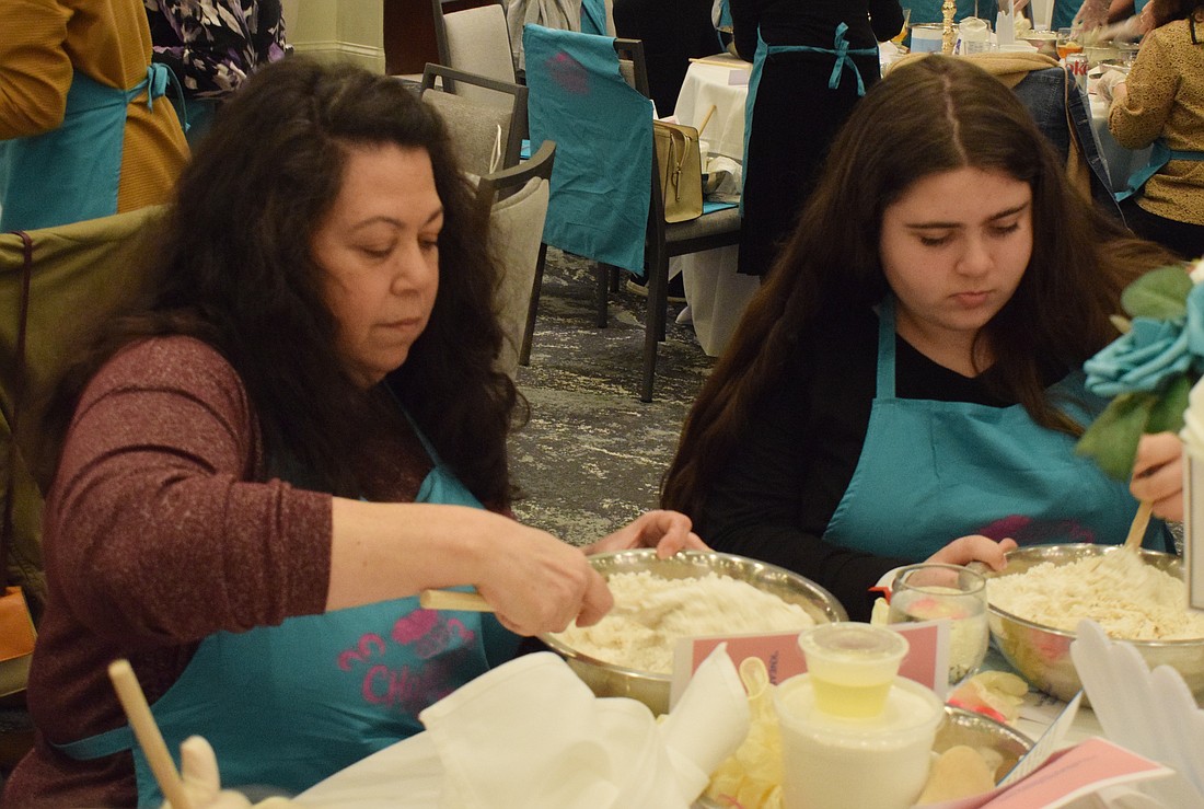 Sarasota's Marni Abrams participates in her first Mega Challah Bake with her 13-year-old daughter Rachel Abrams. Marni Abrams says it's important to pass traditions, like making challah, onto the next generation.