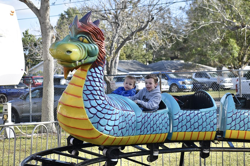 Bradenton 2-year-old Jameson Taal and Wauchula 7-year-old Paxton Braun enjoy the front row.