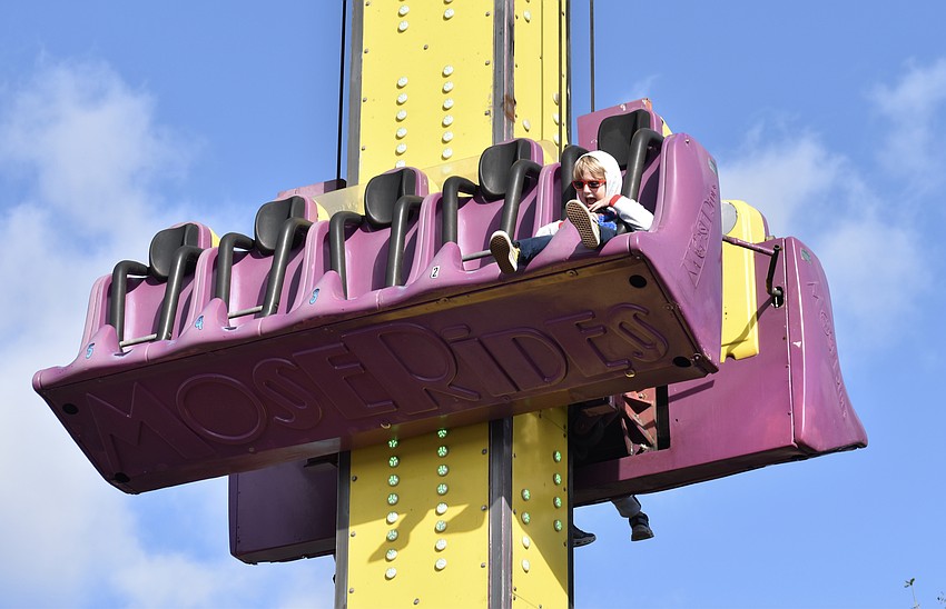 Bradenton 6-year-old Colin Sconberg braves the drop tower alone.