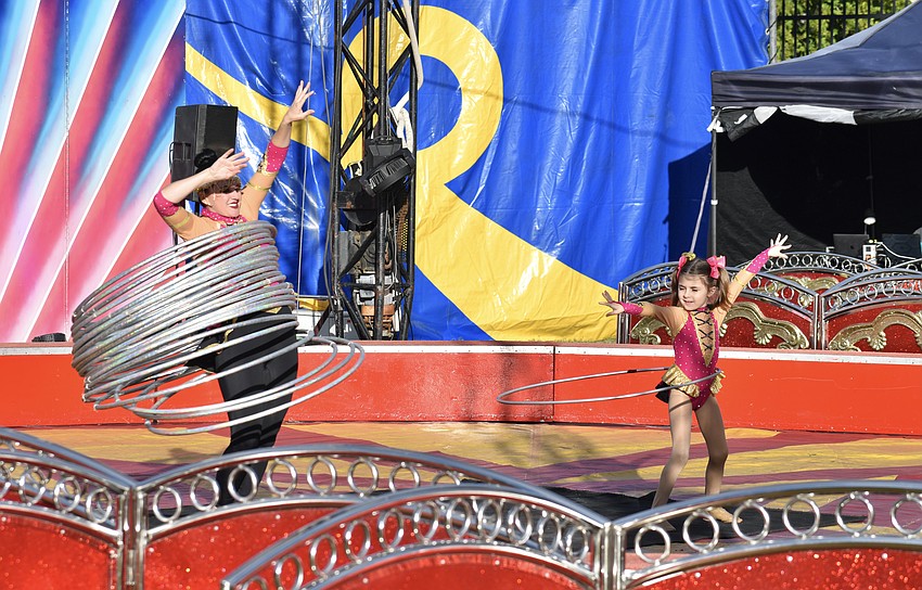 Bradenton's Crystal Coronas and 6-year-old Karine Coronas, of Hollywood, provide circus entertainment at the fair.