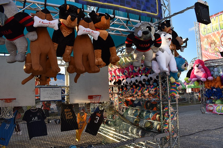 The Belle City Amusements Midway includes numerous booths where participants can win prizes.