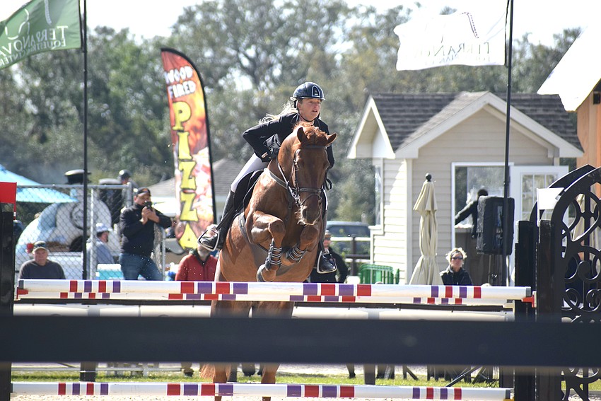 Kristen VanderVeen, the eventual winner of the $50,000 Grand Prix of Sarasota, guides Jasmijn through a jump. While Jasmijn didn't make the final four, VanderVeen won aboard Jireh.