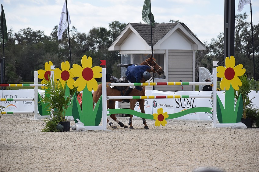 Christian Dior bulks at jumping, and that sent Craig Starr out of the saddle. He managed to land on his feet and wasn't injured.