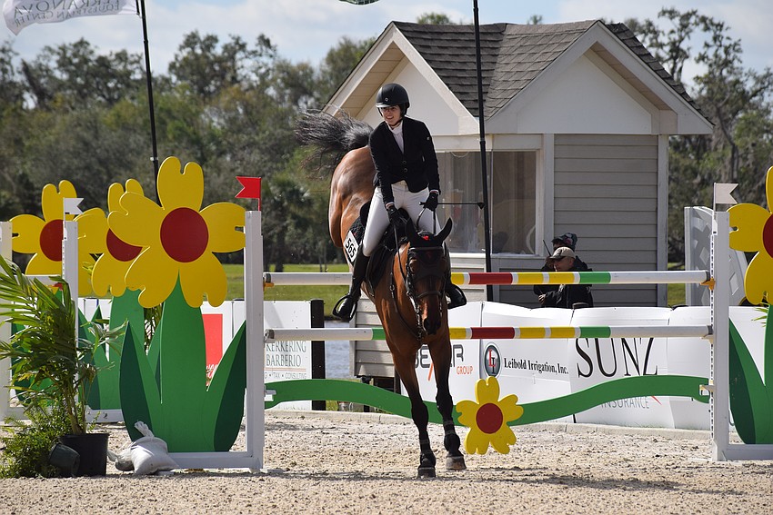 Stephanie Gallucci brings down Broken Heart after a successful jump.