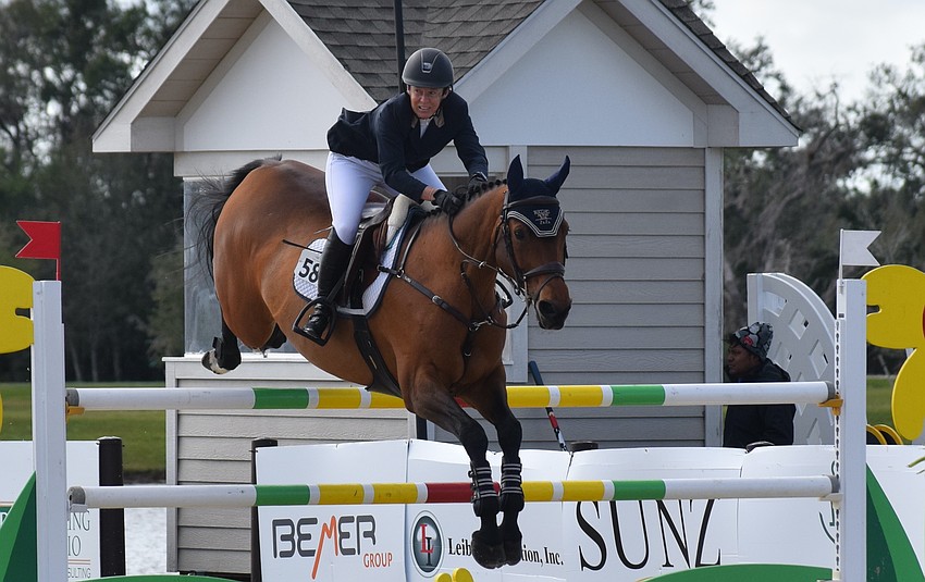 After clearing a hurdle, Marylisa Leffler comes down with Zaza Z. They failed to make the final four.