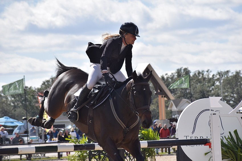 Kristen VanderVeen and Jireh complete their final jump to take first place in the $50,000 Grand Prix of Sarasota Jan. 14 at TerraNova Equestrian Center in Myakka City.