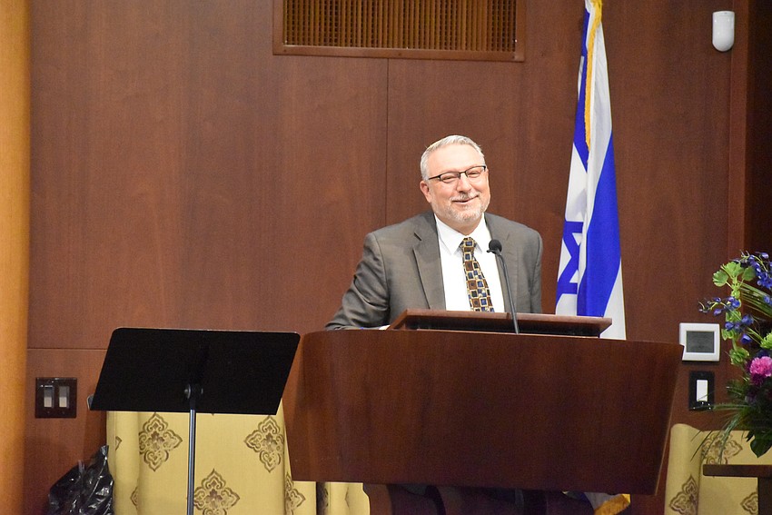 Rabbi Michael Shefrin gives a blessing to the audience.