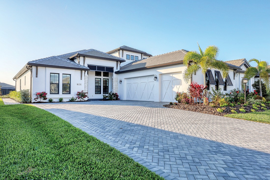 This Lakehouse Cove at Waterside home at 765 Tailwind Place sold for $1,717,500. It has four bedrooms, four baths, a pool and 3,451 square feet of living area.