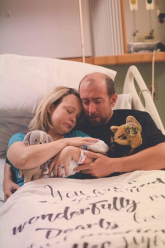 Britni and Zach Sauls only spent a few hours with their son, James Oliver â€œOlllieâ€ Sauls, in the hospital after he was delivered. Photo by Kari Bendig