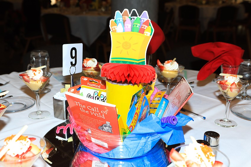 Table decor included school supplies that were later donated.