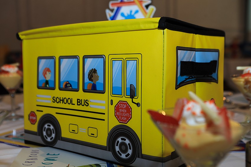 Table decor included school supplies that were later donated.