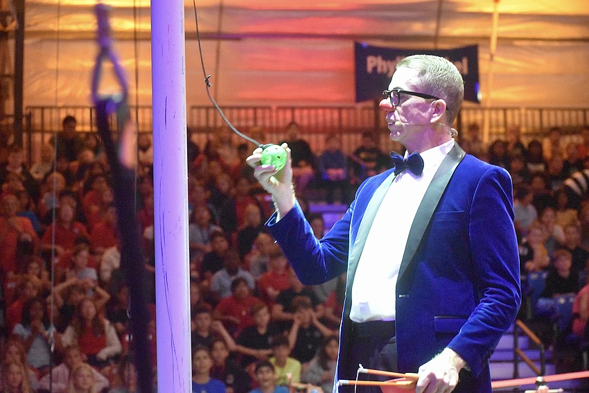 Bucky demonstrates how Newton's Laws work in Circus Arts Conservatory's Circus Machine.