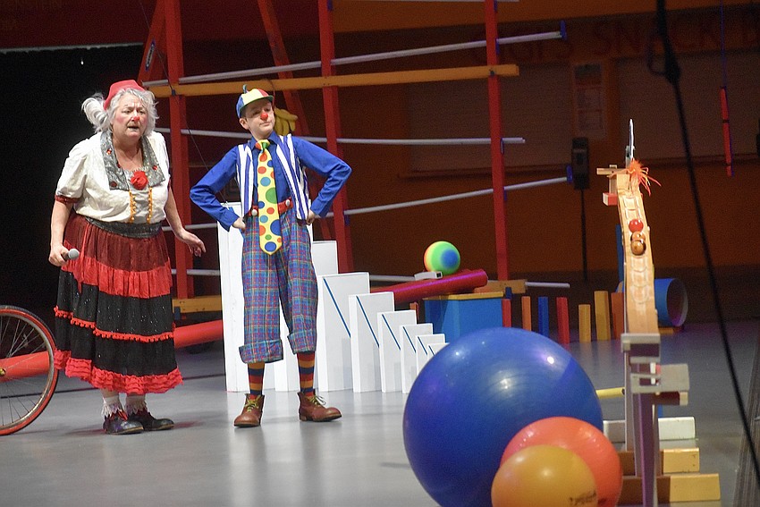 Karen Bell and Kepler Henry demonstrate Newton's Law of Motion.