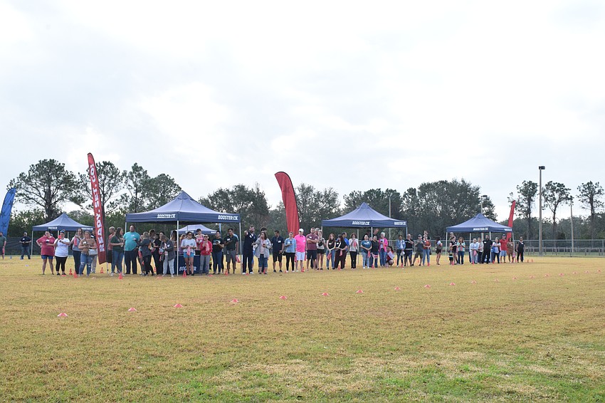 Dozens of Freedom Elementary School parents wait to see their students participate in the Fun Run.