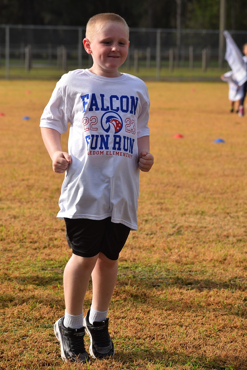 Freedom Elementary School first grader Jack Bardin bunny hops his way around the track.