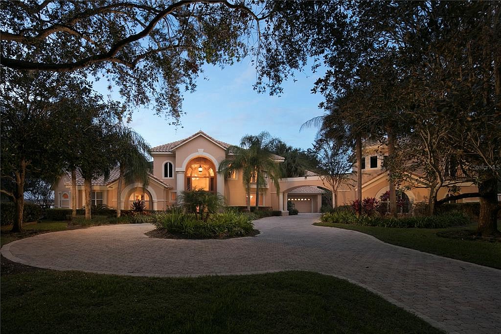 The home at 9326 Bentley Park Circle, Orlando, sold Jan. 20, for $3,150,000. This custom estate offers views of Lake Tibet Butler and is located in guard-gated Bentley Park in Bay Hill.