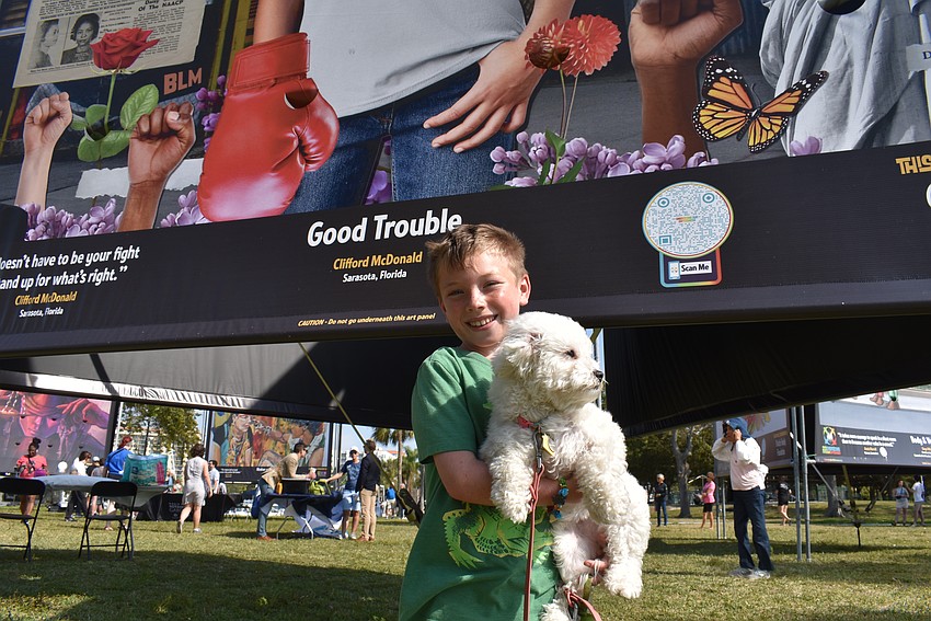 Oliver Weiner and his dog pose in front of their favorite artwork, 