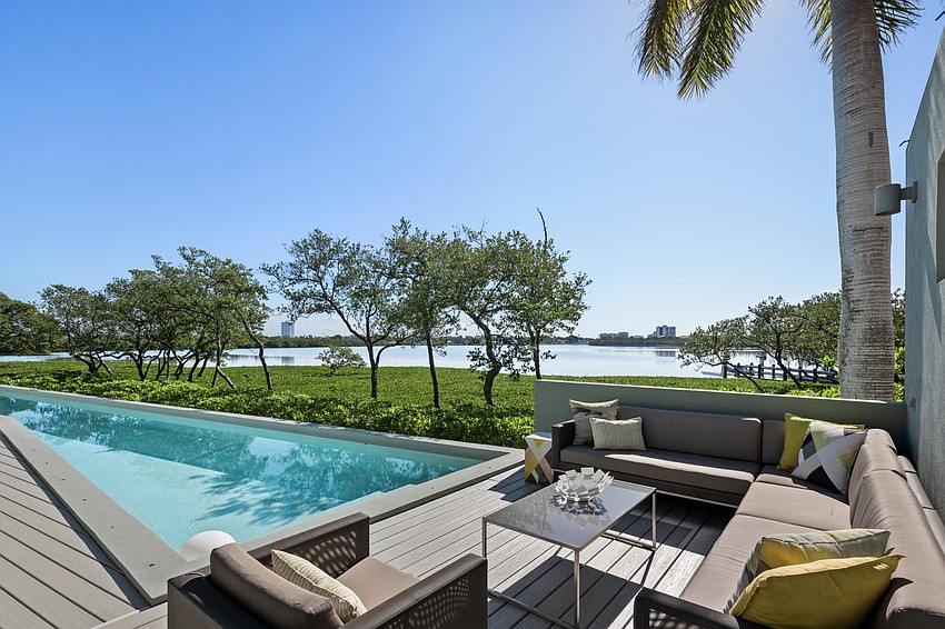 The lap pool and deck overlook Pansy Bayou.