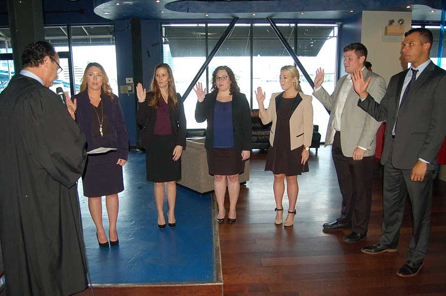 Judge Gary Flower administered the oath of office to the 2017-18 YLS Board of Governors: From left, Jessica Mathis (president-elect), Amanda Thomas (treasurer), Courtney Gaver, Megan Moon, David Chauncey and Andrew Scott.