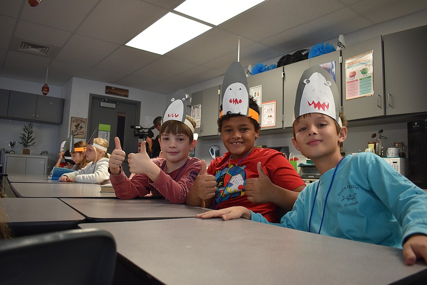 Tancred McCarthy, Max McMaster and Levi Nimz show off their shark hats.