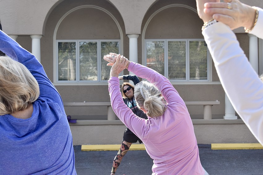 Debby Debile modified her yoga class so mats weren't needed in the parking lot.