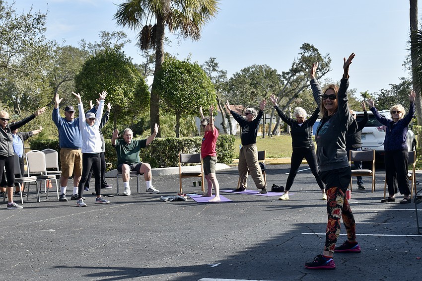 Prospective students stretch before a brief meditation to end the class.