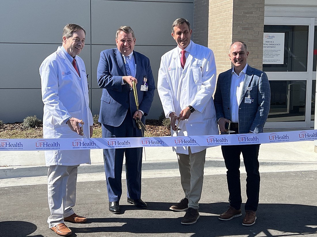 Dr. Edward Roe III, Greg Miller, executive vice president and chief operating officer of UF Health-Jacksonville, Dr. Andy Godwin and Dr. Jay Woody, founder of Intuitive Health, cut the ribbon Jan. 27 at the UF Health Emergency & Urgent Care Center - Baymeadows.