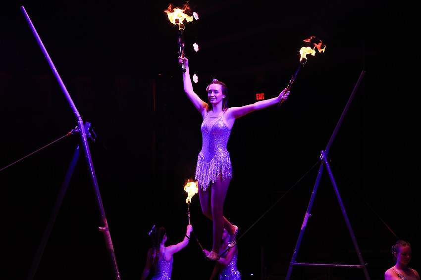 Sailor Circus students work the slack rope.