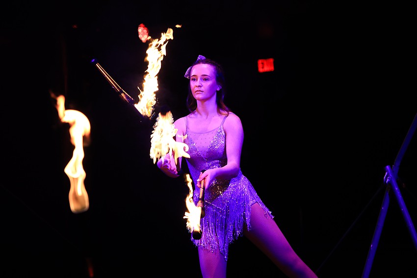 Sailor Circus students work the slack rope.
