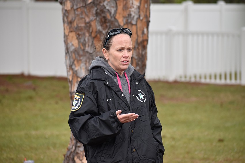 Creekwood's Melanie Wildt addresses the Girl Scouts during the event.