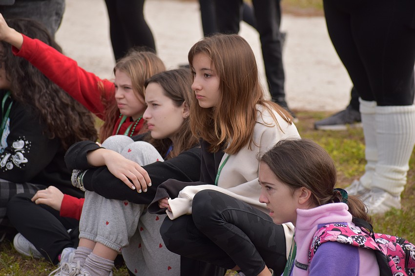 Lakewood Ranch 15-year-old Alice Barr, 13-year-old Isabella Arteaga, and 14-year-old Reese Gurski, and Bradenton's 13-year-old Carlee Lesinski, watch a presentation by the Manatee County Sheriff's Office.