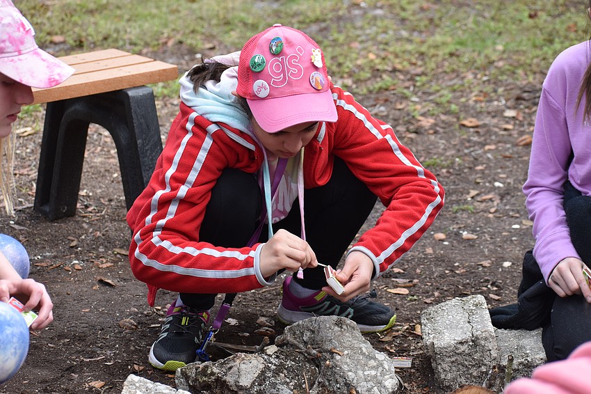 Lakewood Ranch's 12-year-old Haven Wood practices her fire building skills.