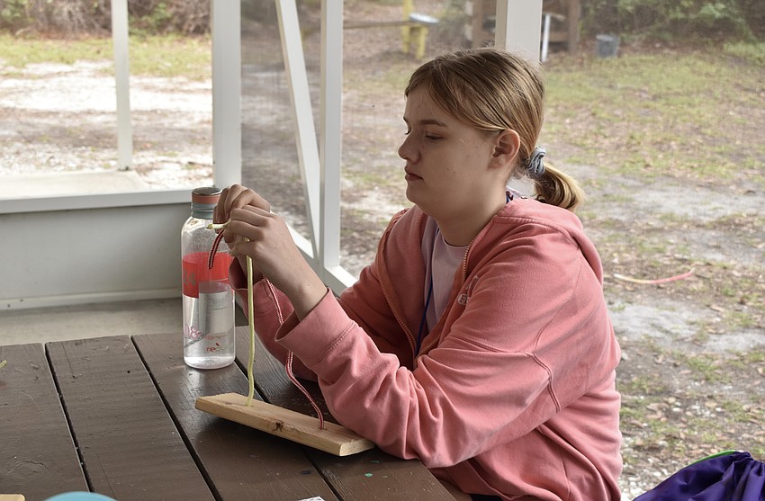 Lakewood Ranch 12-year-old Olivia Drobny practices tying knots.