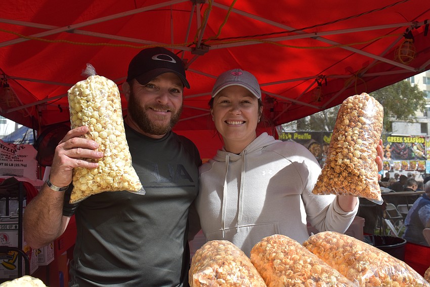 Dewayne and Brittney Proctor serve freshly popped kettle corn.