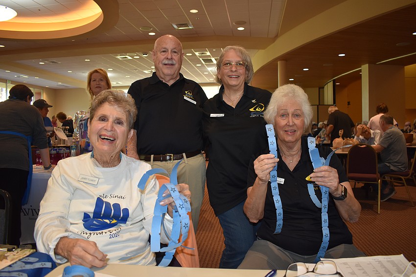 Janet Tolbert, Daryl Worobow, Phyllis Swerdlow and Patty Swerdlow sell food tickets at the Sarasota Jewish Food Festival.