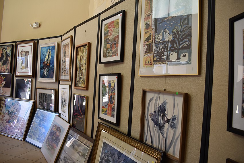 Attendees shopped for treasures at the art sale that the Temple Sinai congregates donated.