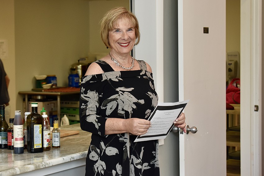 Valerie Evanko welcomes the cooking class and gives the students Chef Stone's culinary background.