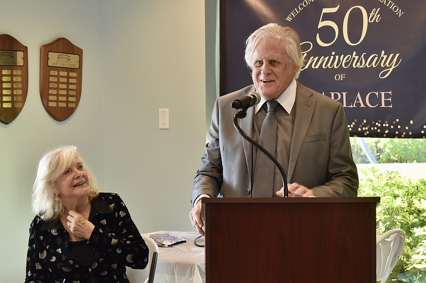 Donna Cornell looks on as her husband Jeff Werner gives the history of Seaplace.