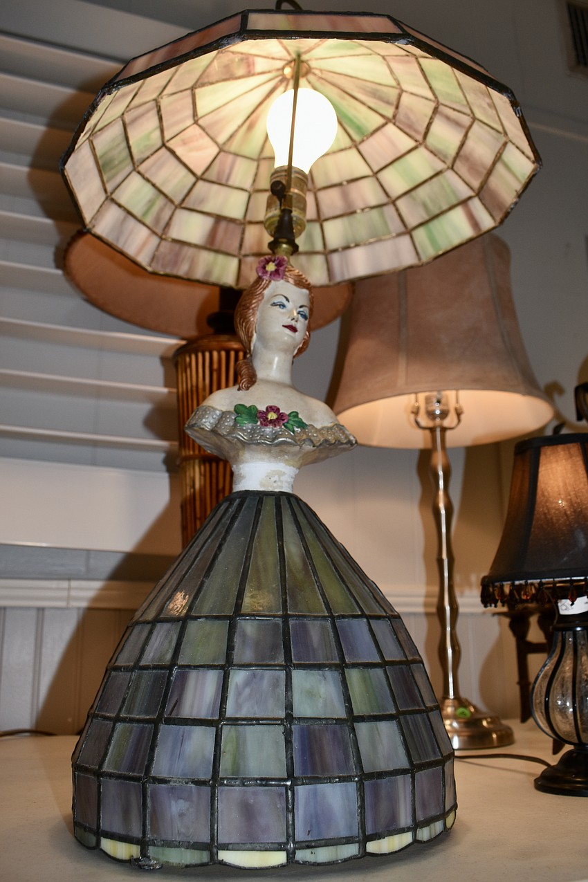 An armless lady lamp for sale.