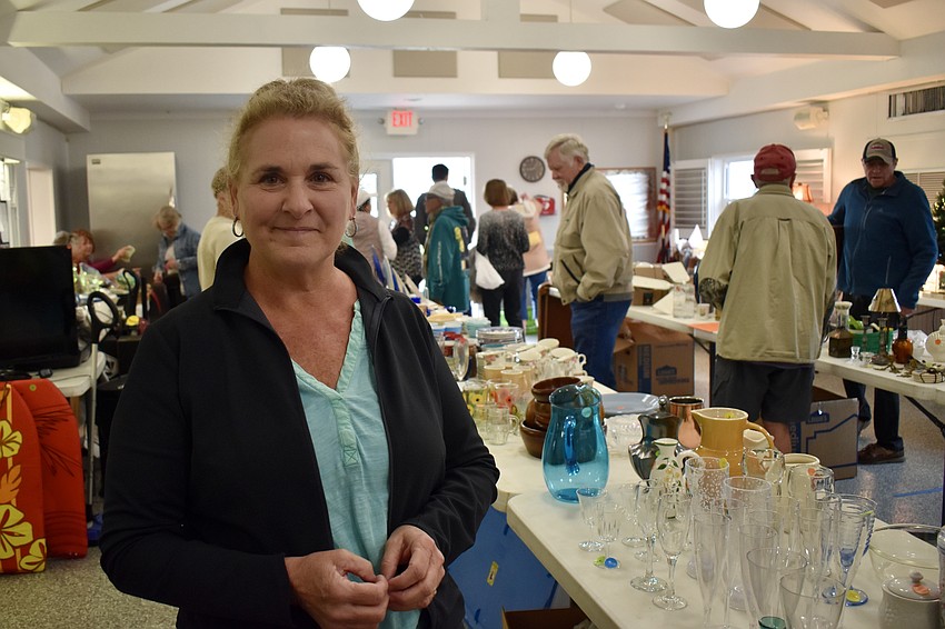 Anne Long helps work the sale.