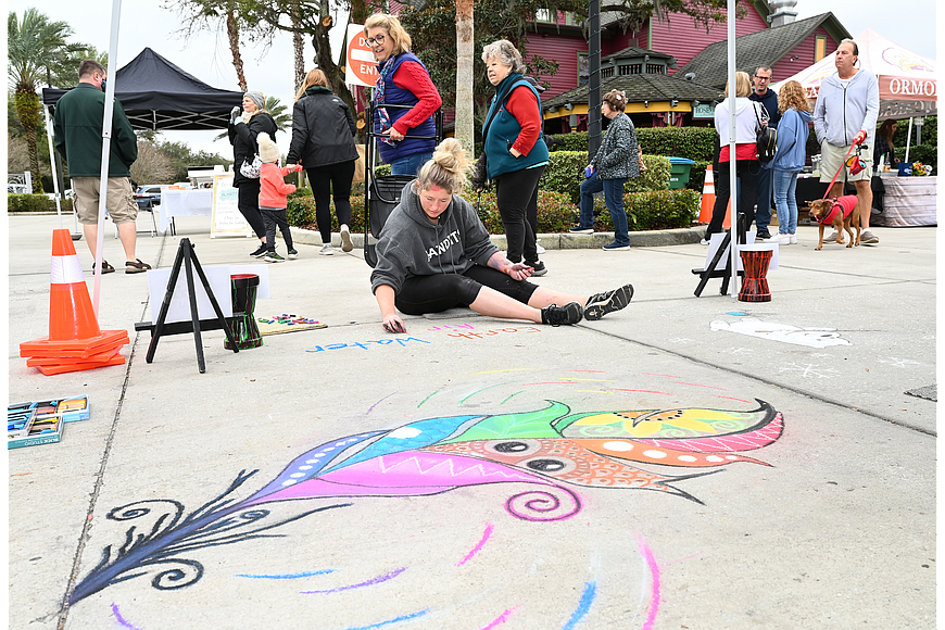 Katie Widdison takes part in the chalk art competition at the eight annual Granada Grand Festival of the Arts. File photo by Michele Meyers