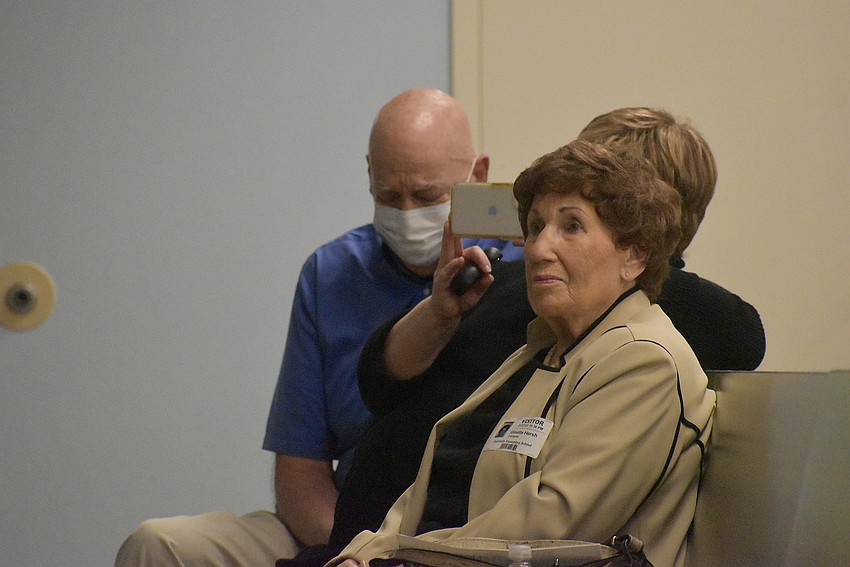 Steve Koenig and Ginette Hersh listen to the students sing, “A Million Butterflies.”