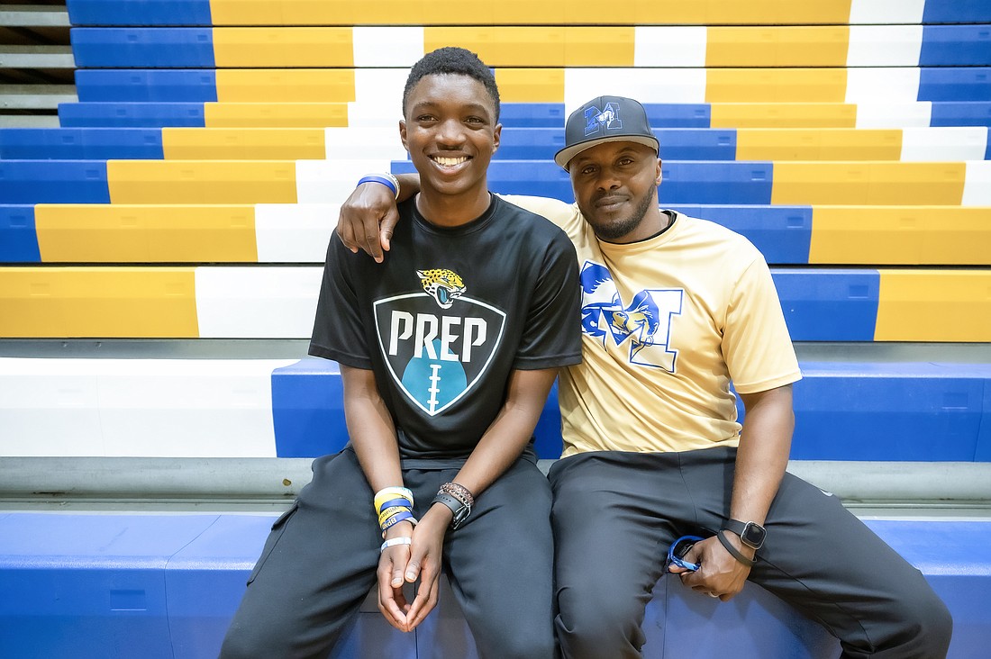 Mainland quarterback "DC" Creecy with offensive coordinator Snap Wood. Photo by Michele Meyers