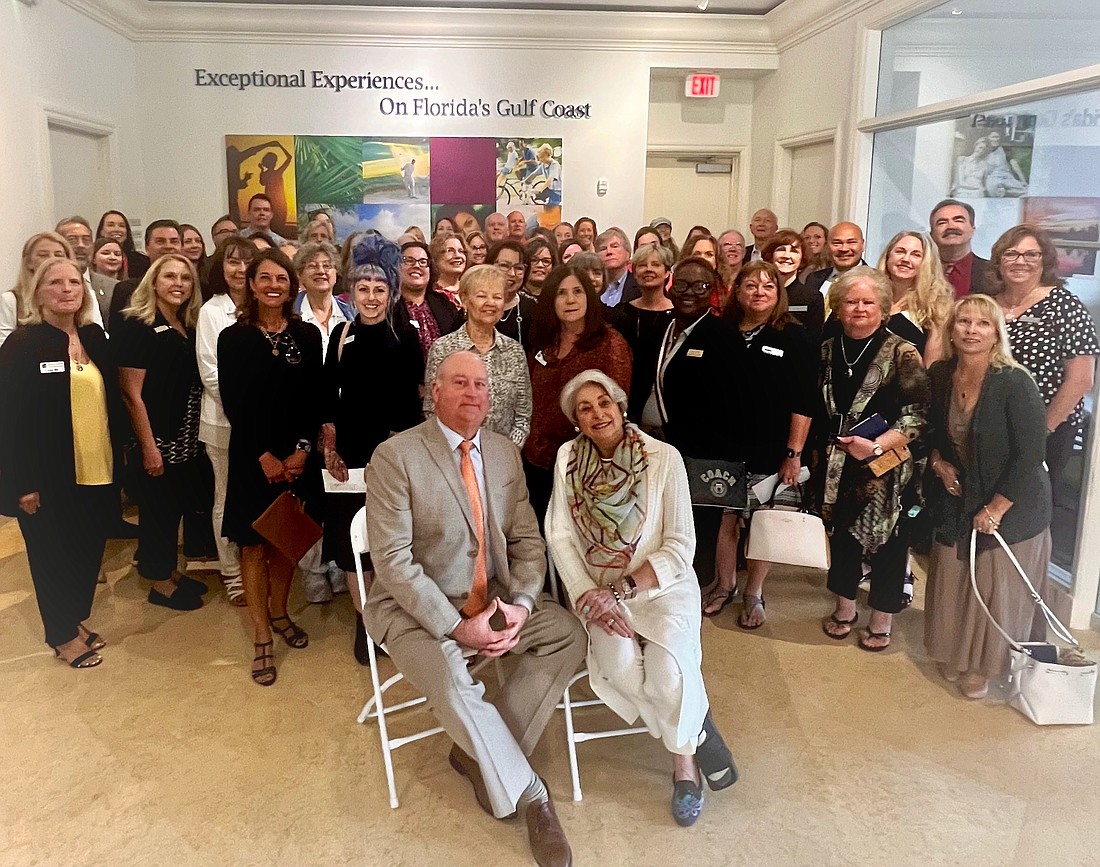 Drayton Saunders and Michael Saunders pose with representatives of all of the organizations that received grants during the Jan. 26 grant distribution event at the company’s Lakewood Ranch office.