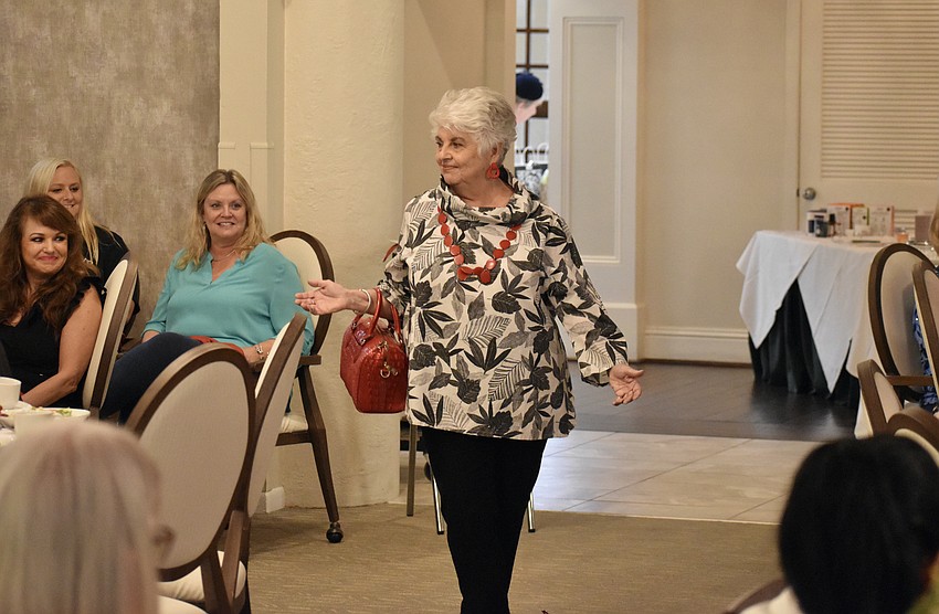 Palm Aire's Peg Beck walks the runway with all eyes upon her.