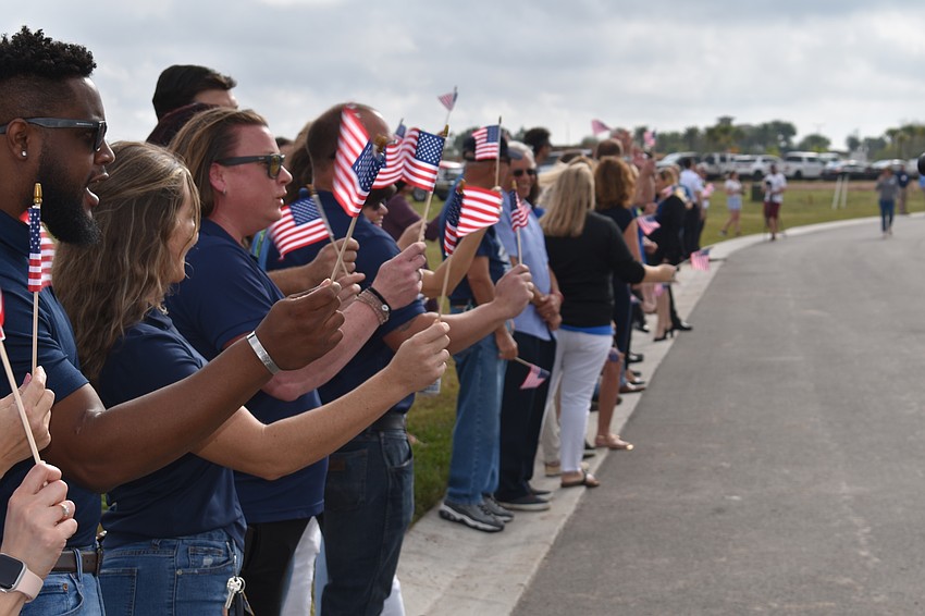 Patriotism was prevalent as Army Sgt. Lucio Gaytan and his family arrived via a parade to see his new homesite at Sapphire Point in Lakewood Ranch.